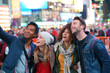 © goodluz - Group of friends having fun at Times Square, NYC