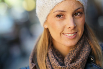 Young woman with trendy style standing in the street