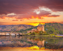 Eilean Donan Castle Against Sunset In Highlands Of Scotland