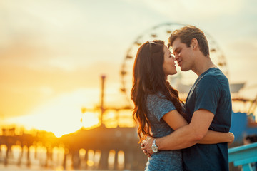 Wall Mural - romantic couple about to kiss at sunset