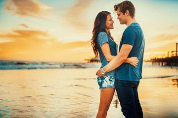 Wall Mural - romantic couple at the beach in love