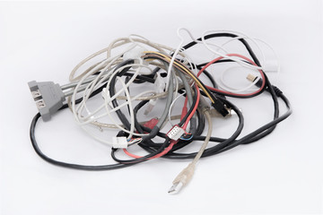 Bunch of great number of different colored cables with various connectors for various devices