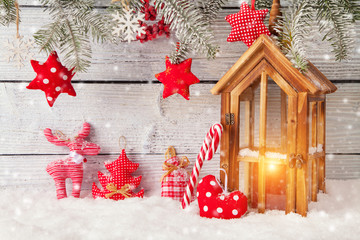 Wall Mural - Burning lantern and christmas decoration on wood