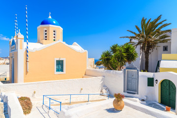 Wall Mural - Typical church in Oia village on Santorini island, Greece