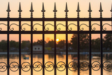 Metal Fence At Sunset