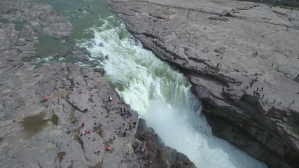Wall Mural - panning aerial view of the hukou waterfall, part of the yellow river in china