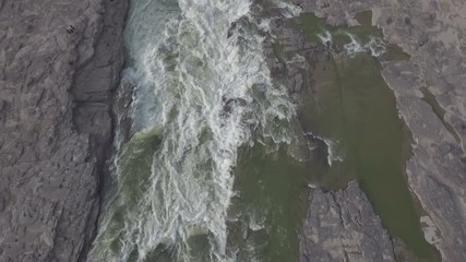 Wall Mural - aerial view of fresh water cascading down the hukou waterfalls along the yellow river in china