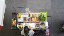 Top View Of A Thai Street Food Vendor Cart Preparing Food