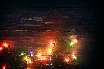 Wall Mural - christmas lights background - rustic merry christmas (xmas) background with plank wood with colorful