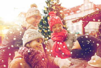 Poster - happy family over city christmas tree and snow