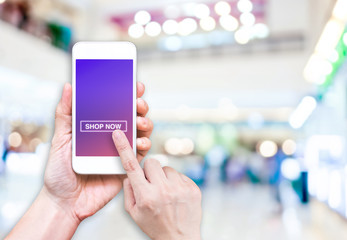 Aufkleber - Hand holding mobile  with shop now button and empty screen for a