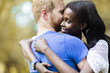 © NDABCREATIVITY - Couple in love hugging and kissing peacfully outdoors