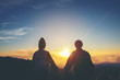 Silhouette of couple  holding hands at sunset