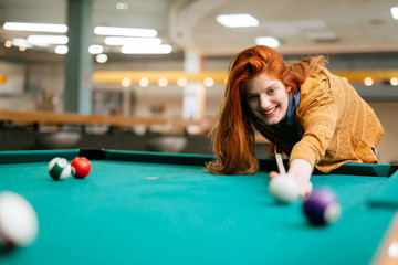 Wall Mural - Beautiful woman playing snooker