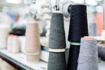 Wool and thread spools on desk