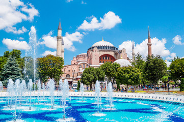 Wall Mural - Hagia Sophia (Ayasofya) museum and fountain view from the Sultan Ahmet Park in Istanbul, Turkey