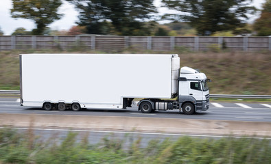 Wall Mural - Large white double decker lorry on the british motorway