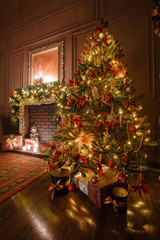 Wall Mural - Calm image of interior Classic New Year Tree decorated in a room with fireplace