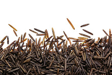 Border Of Black Rice Close-up  On White Background. Isolated. Decorative Frame Of Wild Brown Unpolished Rice.