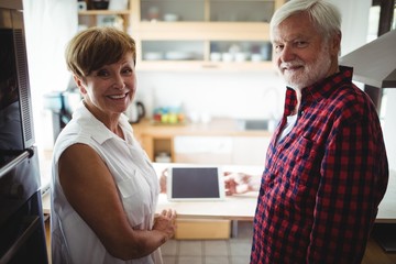 Wall Mural - Senior couple using digital tablet