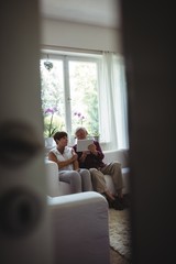 Wall Mural - Senior couple using digital tablet