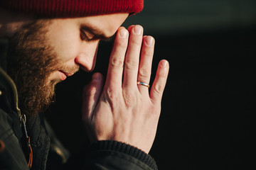 Man praying outside to God