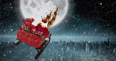 Poster - Composite image of high angle view of santa claus riding on sled