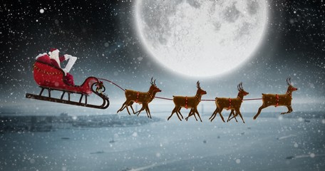 Poster - Composite image of side view of santa claus riding on sleigh dur