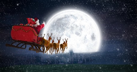 Poster - Composite image of santa claus riding on sleigh with gift box