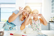 © Flamingo Images - Playful Mum and daughter with pastry mustaches