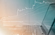 © ahorizon - ivestment business concept stock candlestick chart pattern and notebook  laptop background