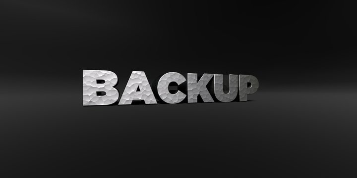 BACKUP - hammered metal finish text on black studio - 3D rendered royalty free stock photo. This image can be used for an online website banner ad or a print postcard.
