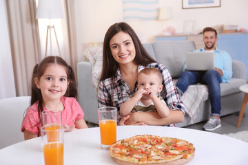 Poster - Happy family eating food on kitchen