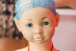 Head of doll or mannequin with blue shabby hair, close-up