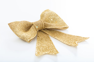 Golden bow on white background