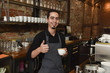 © Wordley Calvo Stock - young italian barista or coffee maker at restaurant shop preparing milk cream at cafe machine