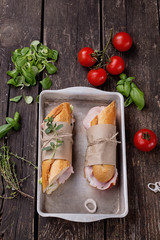 Wall Mural - Sandwiches on rustic wooden Board