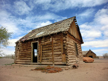Abandoned Old Weathered Log Cabin In American Desert