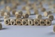 Symptome - Holzwürfel mit Buchstaben