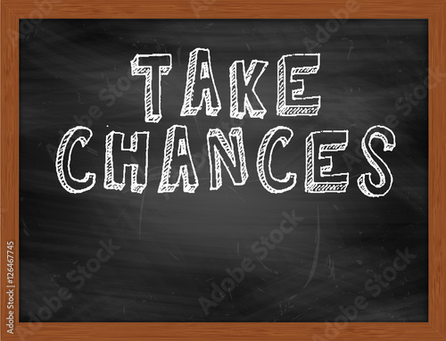 Fotografie, Obraz TAKE CHANCES handwritten text on black chalkboard
