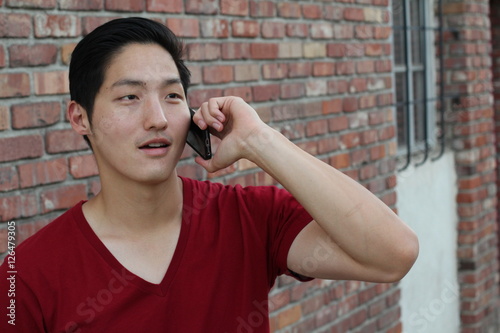 Phone Talk Closeup Portrait Headshot Of Asian Man Talking