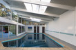 © coralimages - Indoor pool with tilted roof.