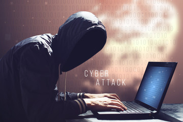 Wall Mural - Hacker with laptop initiating cyber attack