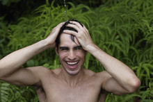 Young Man Having Shower Outdoors