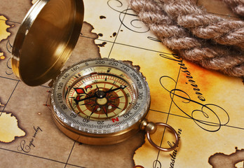 compass and rope on map