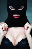 Fototapeta Nowy Jork - girl in bra and balaclava - black and white photo in studio of a psycho girl terrorist