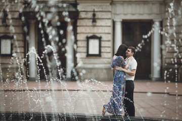 Wall Mural - Beautiful couple next to the nice fountain