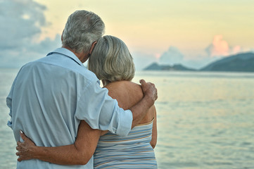 Sticker - elderly couple rest at tropical beach