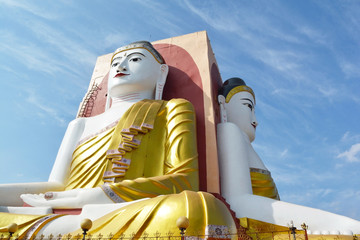 Wall Mural - Kyaikpun Pagoda, four giant buddha statues Pagoda in Bago, Myanmar.