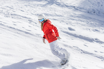 Wall Mural - Ssnowboarder on slopes in the sunny morning